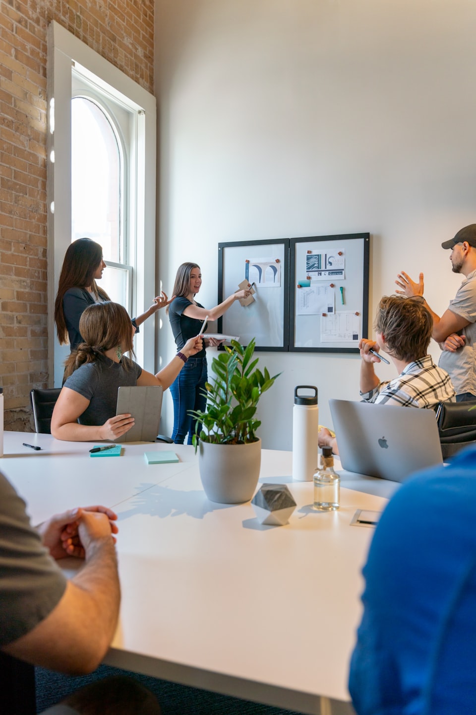 Diverse team collaborating around a conference table.