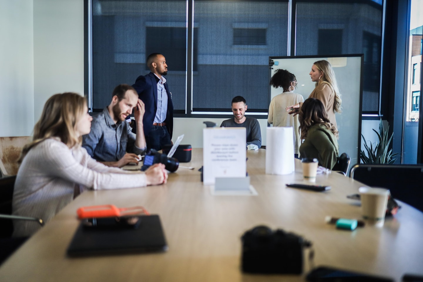Diverse business team discussing ideas around a conference table.