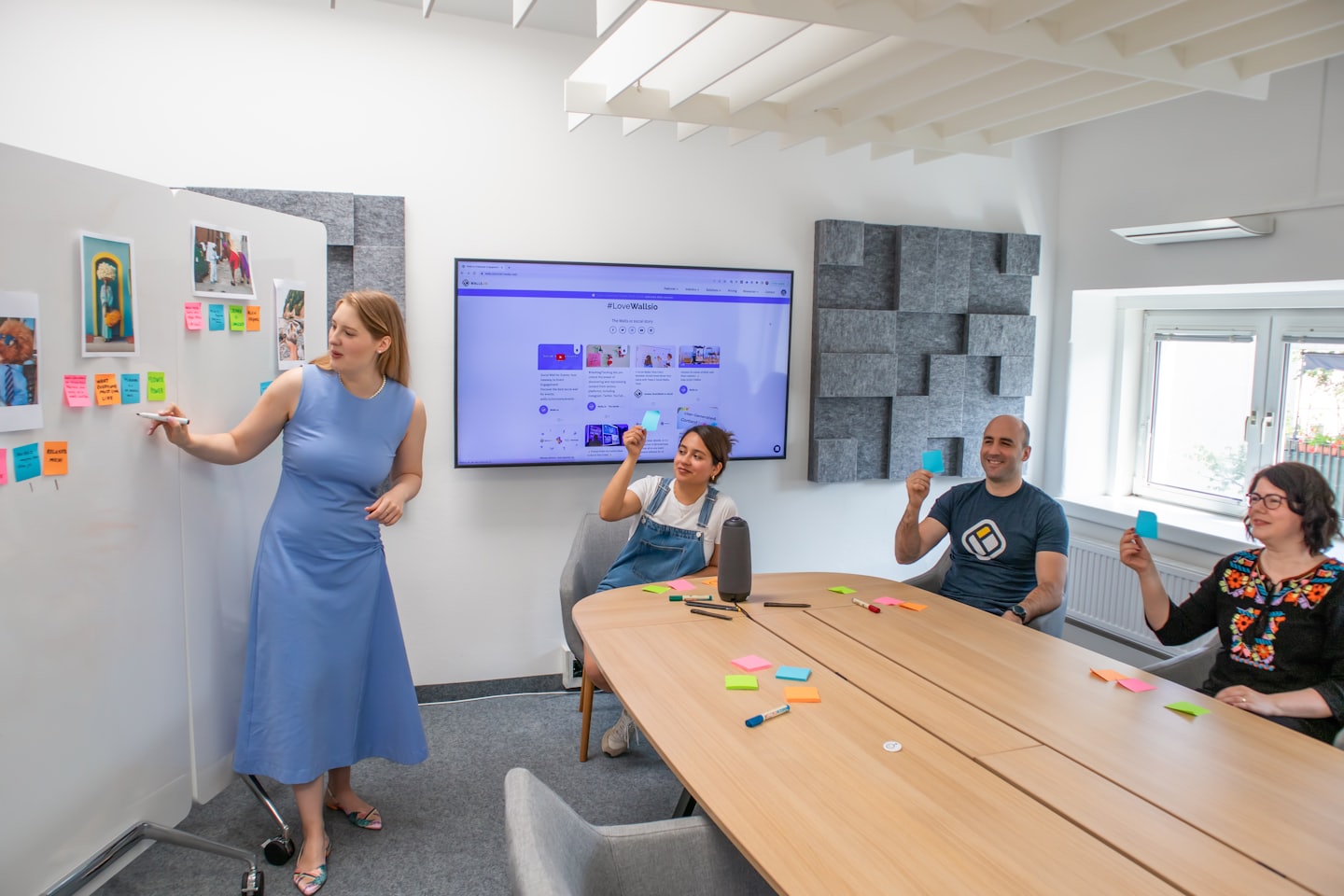 Diverse professionals brainstorming ideas in a modern meeting room.