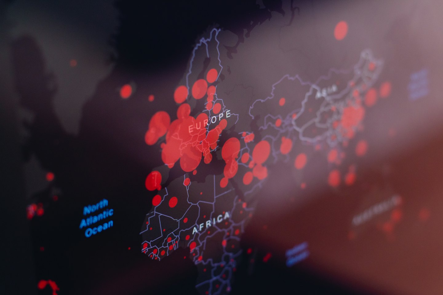 Digital world map with red data points over Europe and Africa.
